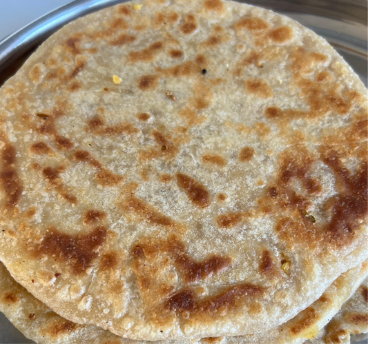 Stack of flatbreads on a metal tray